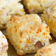 Buttery and flaky these homemade Cheesy Ham buttermilk biscuits are adorned with ham and cheddar cheese. Seriously amazing! This southern style breakfast with homemade biscuits and country ham and gooey cheese is the perfect hearty breakfast! These biscuits are buttery, savory, and a well-deserved treat!