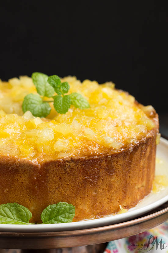 Pineapple Pound Cake the best pound cake dessert recipe. A taste of the tropics, two step pineapple pound cake, is super moist and exceptionally easy to make in just two steps. Whole pound cake with glaze dripping down sides.