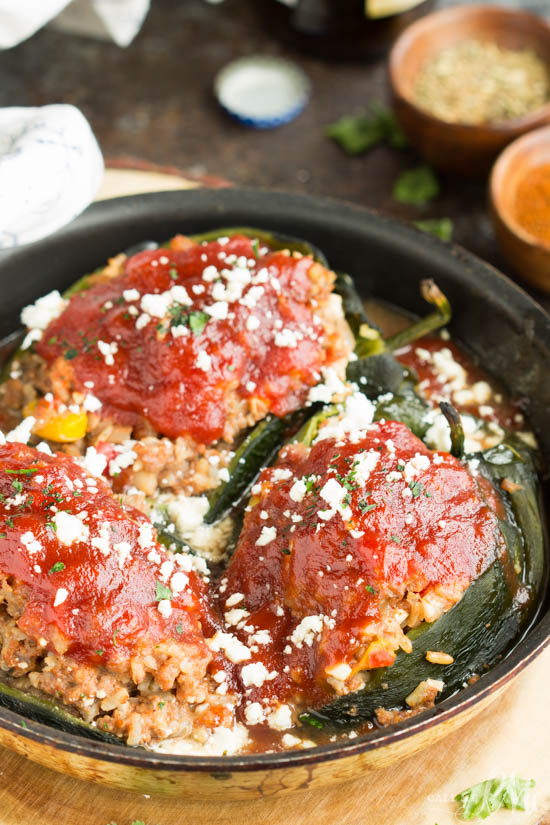 Roasted poblano peppers are stuffed with a hearty meatloaf in this Home-style Meatloaf Stuffed Poblanos recipe. Topped with a rich tomato sauce and tangy feta cheese, this is comfort food at its best.
