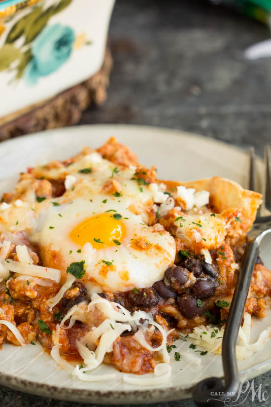 Huevos Rancheros Casserole a zesty Mexican inspired casserole makes a hearty dinner or a special brunch. It's a comfort food dinner or breakfast everyone will love! Layers of tortillas, seasoned meat, eggs, and cheese is a meal even a novice cook can make. 
