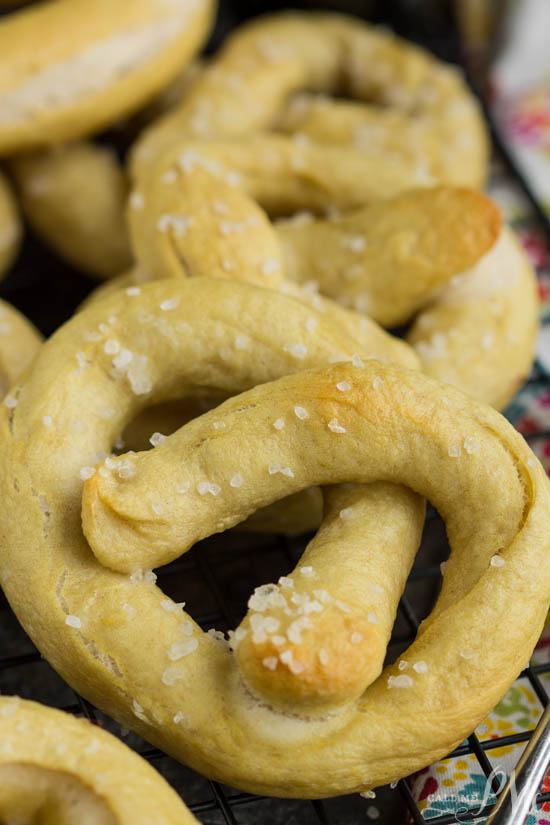 Soft-baked, chewy, and fluffy inside, these homemade pretzels take no time at all to make. From-Scratch Soft Pretzels are soft and chewy on the inside with a salty and crackly brown outside. Just when you thought homemade soft pretzels couldn’t get any better, they do! From-Scratch Soft Pretzels have a wonderful flavor & chewy bite.