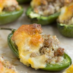 Filled with sausage and topped with cheddar, Baked Fiery Sausage Jalapenos couldn't be a more perfect entertaining appetizer. A simple bite-size appetizer packed with flavor that comes together quickly and easily with just four ingredients.