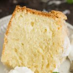 Dessert Recipe. This Coconut Cream Cheese Pound Cake recipe is crazy delicious. Dense and buttery this pound cake is topped simply with a sprinkle of powdered sugar then served with whipped cream and berries. This rich, dense, buttery cake is dessert perfection.