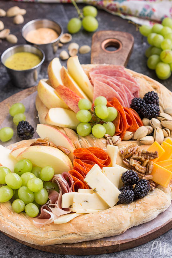Charcuterie board. meat cheese board. entertaining. Topgolf Pretzel Board Recipe, a no-fuss party starter, this giant pretzel filled with meats and cheeses provides endless grazing and is always a crowd-pleaser. It's a nice twist on a classic charcuterie board. Topgolf Pretzel Board