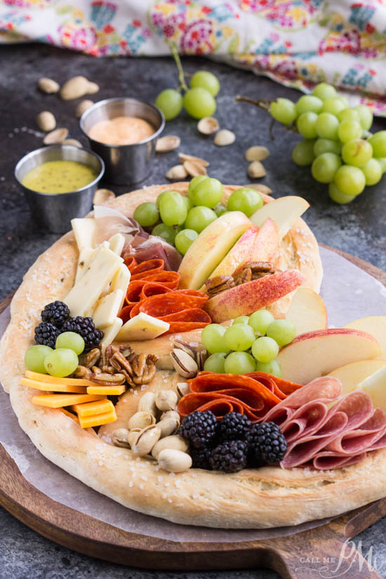 Topgolf Pretzel Board Recipe, a no-fuss party starter, this giant pretzel filled with meats and cheeses provides endless grazing and is always a crowd-pleaser. It's a nice twist on a classic charcuterie board. entertaining. Meat and cheese board. Charcuterie board. Topgolf Pretzel Board