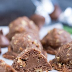 Chocolate Pecan Sandies Secret Kiss Cookies has a secret surprise inside. These luscious chocolate cookies are stuffed with a chocolate kiss. They are for-real amazing! #chocolate #cookie #recipe