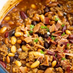 Hearty, flavorful, nutritious, and healthy, Stovetop Bourbon Bacon and Sausage 'Baked' Beans recipe thick and meaty. They make the perfect complement to your game day table, potluck, or barbecue all year.