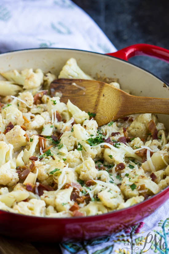 Sautéed Cauliflower and bacon oven baked in a cheesy creamy garlic sauce topped with bubbling mozzarella and parmesan cheese!