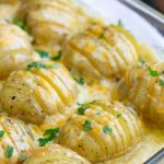 An easy and delicious recipe for cheesy, garlicky, crazy-delicious Hasselback Scalloped Potatoes. They are the perfect side dish for a family dinner!