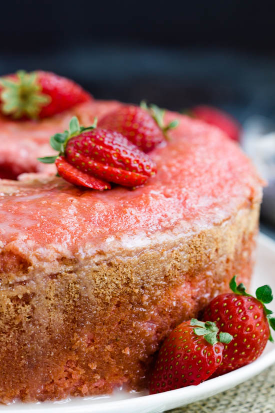 Indulge in a mouthwatering strawberry cake on a simple white plate.