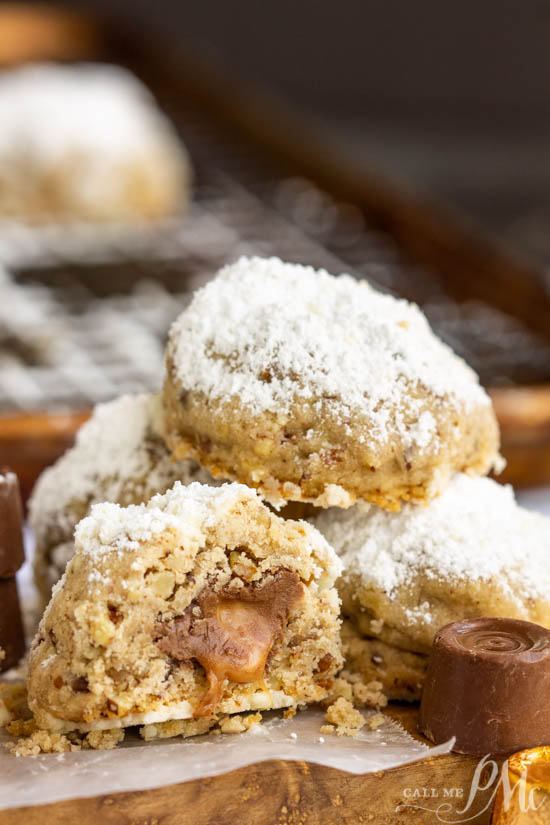 Hidden Rolo Snowball cookies, a hidden Rolo chocolate and caramel candy make this cookie a sweet surprise. This is a fun cookie recipe alternative.