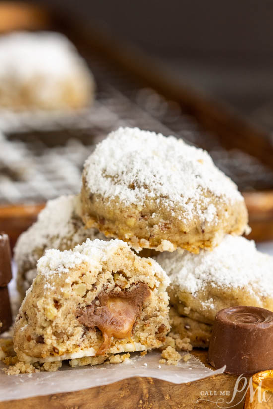 Hidden Rolo Snowball cookies, a hidden Rolo chocolate and caramel candy make this cookie a sweet surprise. This is a fun cookie recipe alternative. #cookies #chocolate #rolos #recipes #dessert Hidden Rolo Snowball cookies