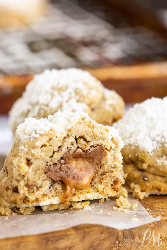 Hidden Rolo Snowball cookies, a hidden Rolo chocolate and caramel candy make this cookie a sweet surprise. This is a fun cookie recipe alternative. #cookie #chocolate Hidden Rolo Snowball cookies