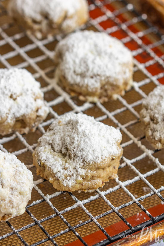 Hidden Rolo Snowball cookies, a hidden Rolo chocolate and caramel candy make this cookie a sweet surprise. This is a fun cookie recipe alternative. #cookies #dessert #chocolate Hidden Rolo Snowball cookies
