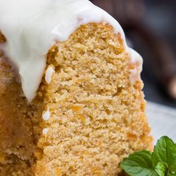 A moist Best Sweet Potato Pound Cake with Cream Cheese Frosting is highlighted by a cinnamon, cloves, and topped with cream cheese glaze.