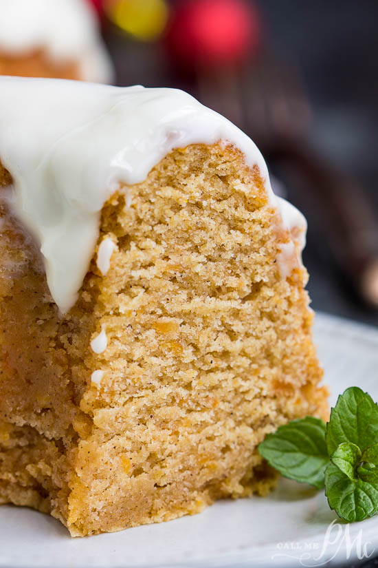 Bundt cake with slice cut out on a white plate..