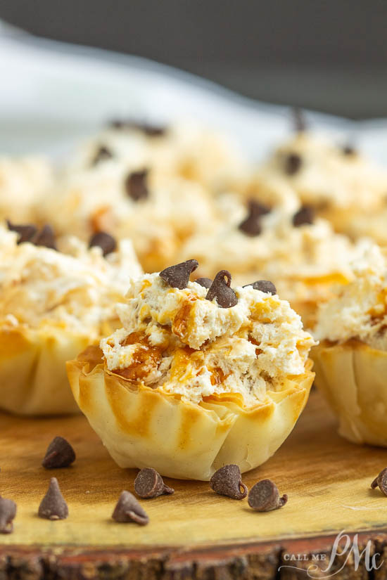 No-Bake Butterfinger™ Cheesecake Tarts recipe is a creamy no-bake pie with Butterfinger candy in a pre-made tart shell. Small tarnlet filled with cheesecake and topped with mini chocolate chips