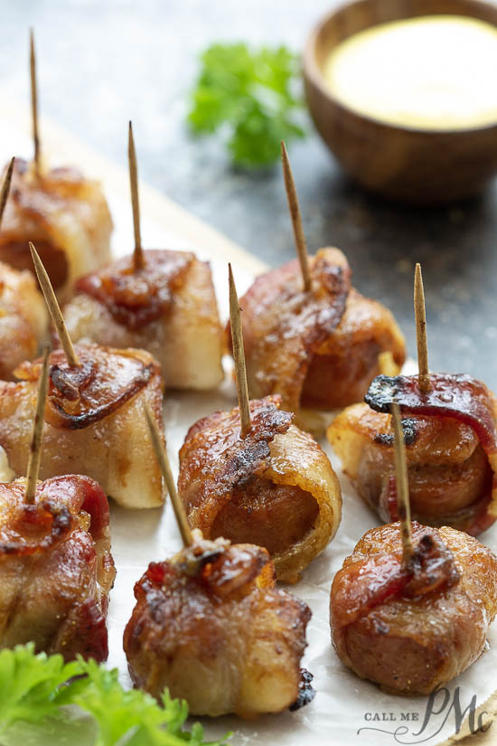Bacon Wrapped Sausage Bites are a game day, party must-have, or easy meal prep meal that’s packed with protein and flavor. bite sized bacon wrapped appetizers on toothpicks.