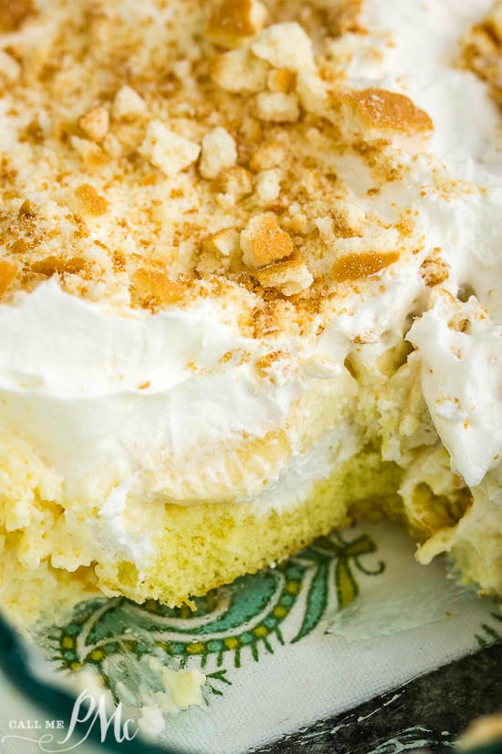 No Bake Banana Pudding Twinkie Cake has an incredible cream cheese pudding filling, lots of bananas, & is served over delicious Twinkie snack cakes! A creamy, no-bake dessert topped with crumbled cookies in a glass dish.
