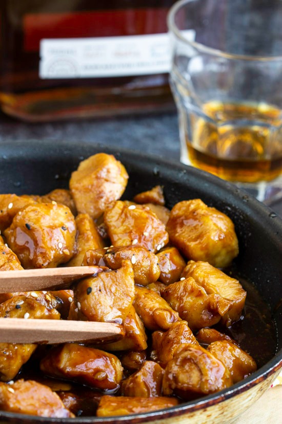 Recipe. Spicy and sweet, Copycat Cajun Cafe Bourbon Chicken Bites are tender chunks of chicken cooked in a bourbon and brown sugar sauce. #appetizer #entree #recipe #chicken Copycat Cajun Cafe Bourbon Chicken Bites