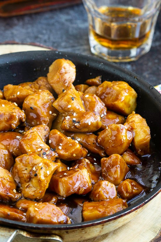 Recipe. Spicy and sweet, Copycat Cajun Cafe Bourbon Chicken Bites are tender chunks of chicken cooked in a bourbon and brown sugar sauce. #appetizer #entree #recipe #chicken Bourbon Chicken Bites