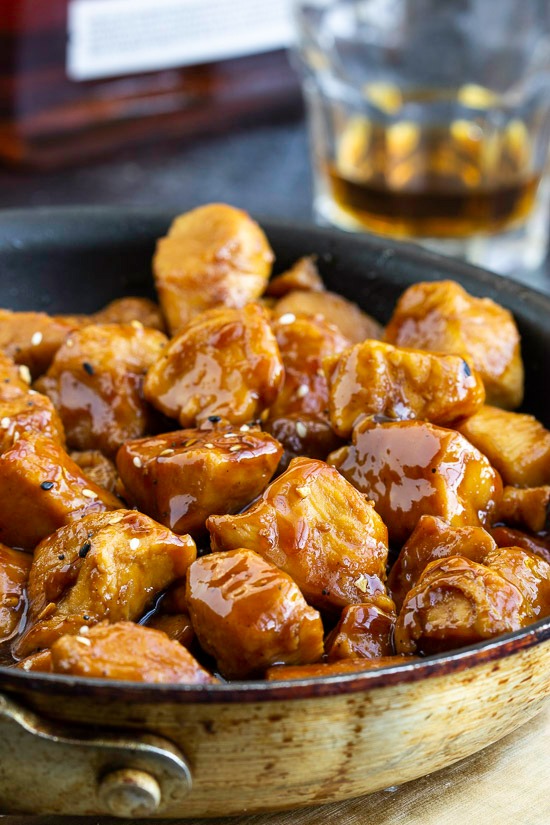 Recipe. Spicy and sweet, Copycat Cajun Cafe Bourbon Chicken Bites are tender chunks of chicken cooked in a bourbon and brown sugar sauce. #appetizer #entree #recipe #chicken