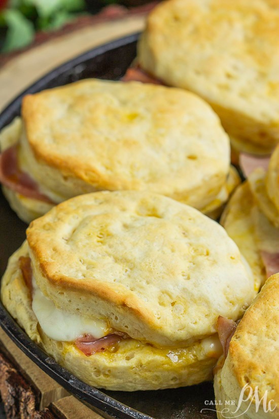 Cheesy Ham Sandwich are loaded with ham and cheese and smothered in an amazing honey mustard sauce. #sandwich #biscuits #cheese #ham