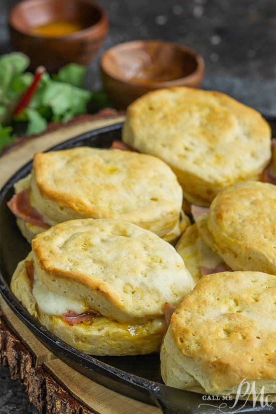 Grands Ham Biscuit Sliders are loaded with ham and cheese and smothered in an amazing honey mustard sauce. #sandwich #biscuits #cheese #ham Cheesy Ham Biscuit sandwiches