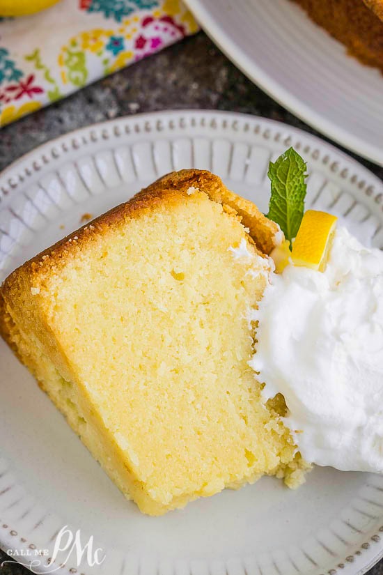 With a bright lemon flavor, Lemon Pound Cake Recipe is buttery, tender, dense yet moist. It's a simple, elegant, classic cake. #cake #dessert #poundcake #lemon Slice of dessert on a plate.