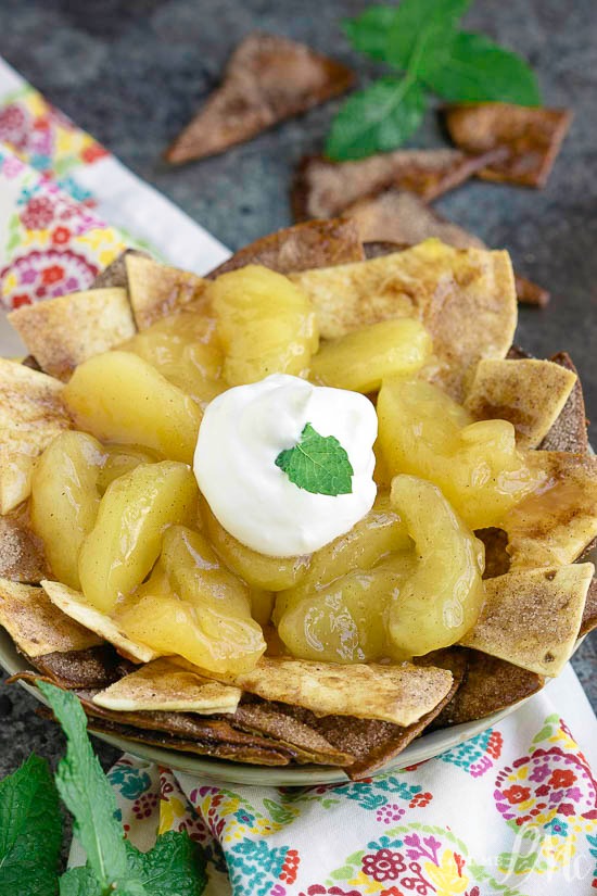 Nachos just reached a new level with Homemade Apple Pie Nachos with Cinnamon Chips. All of the flavors you love in an apple pie, but in a fun and shareable way! #nachos #dessert #dessertnachos #apples #cinnamon #easy #recipe
