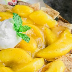 Peach Cobbler Nachos Recipe is a super simple dessert recipe that allows everyone to enjoy the amount they want.