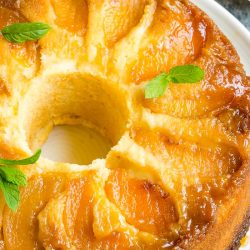 Amaretto Peach Upside Down Pound Cake is bursting with flavor. Two classic cake recipes collide with this perfect end-of-summer dessert.