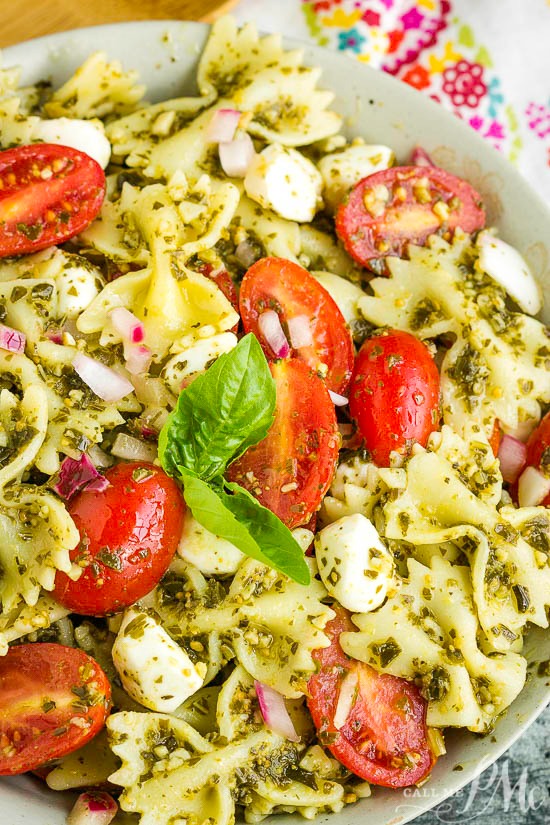 Bowtie Pesto Pasta Salad combines Caprese salad and basil pesto with pasta for a quick, easy, and delicious pasta salad.