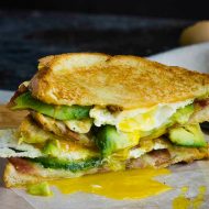 DOUBLE FISTED FRIED EGG BACON AVOCADO GRILLED CHEESE SANDWICH