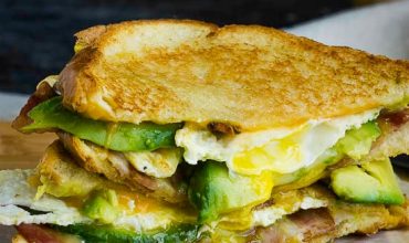 DOUBLE FISTED FRIED EGG BACON AVOCADO GRILLED CHEESE SANDWICH DOUBLE FISTED FRIED EGG BACON AVOCADO GRILLED CHEESE SANDWICH
