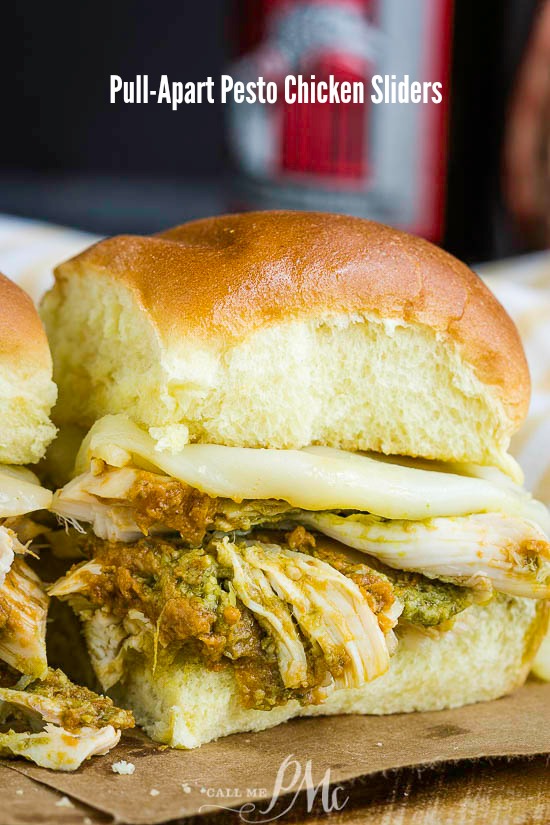 Pull-Apart Pesto Chicken Sliders these baked sandwiches are loaded with juicy chicken and two kinds of pesto. They're great for any party, game day, or snack. #snack #sandwich #sliders #chicken #pesto #gameday #food #picnic #easy #dinner #kids #quick #quickmeal #mealprep Pull-Apart Pesto Chicken Sliders