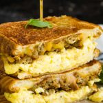 A savory, indulgent sandwich, Breakfast Grilled Cheese Recipe with soft scrambled eggs and sausage, will have you looking forward to breakfast. #breakfast #eggs #scrambledeggs #sauasage #grilledcheese #recipe