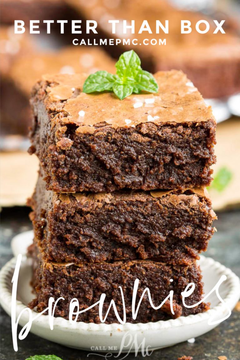 Three stacked brownies with a mint leaf on top are displayed on a small plate, surrounded by more delectable treats in the background. Text overlay reads "Better Than Box" and "callmepmc.com.