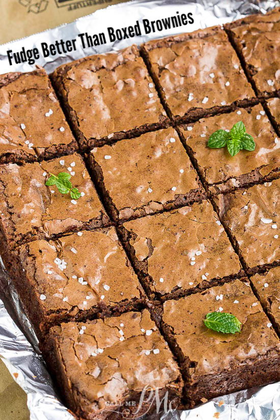 How do I make clean-cut brownies? Itโs important to cut them when theyโre completely cool, otherwise youโll have an ooey gooey mess and brownies that lose their shape. Take the biggest knife you have, preferably one thatโs the length of the entire pan of brownies. Then just cut straight down in one swift motion rather than dragging through the brownies. Between each cut, wipe off your knife with a damp paper towel. Any remaining crumbs will grab onto the brownies as youโre cutting, leading to a messy edge. Make one cut down the middle of the pan, then down the middle of each half. Thatโs the best way to Brownies with a mint leaf on top are displayed on foil.