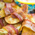 Bacon Wrapped Potato Wedges are a favorite at dinner, snack, or appetizer. This potato recipe has smokey bacon wrapped around a potato wedge that gets crispy on the outside while remaining tender inside.  #bacon #potato #easy #recipe #appetizer #sidedish #whole30 #chipotle #spicy