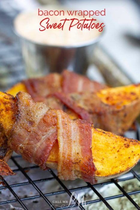 A simple yet delectable recipe, Bacon Wrapped Sweet Potato Wedges are the perfect appetizer or side dish. They are the perfect easy finger food for your holiday party or cookouts. #Glutenfree #Paleo #Whole30 #bacon #recipes #easy #sweetpotatoes #bakedsweetpotatobites #bakedsweetpotatoappetizer #sweetpotatobitesfingerfood #fingerfood #crispysweetpotatobites #appetizerrecipes #sweetpotatorecipes #healthyholidayrecipes #whole30recipes #whole30holidayrecipes #whole30diet Bacon wrapped sweet potato wedges rest on a cooling rack, with a cup of dipping sauce in the background.