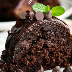 Chocolate Fudge Bundt Cake Recipe is a devilishly rich, ridiculously moist & decadently fudgy recipe that's topped with a short-cut chocolate ganache. #cake #chocolate #chocolatecake #chocolatebundtcake #bundtcake #withpudding #sourcream #recipe #easy #frombox #mix #glaze #homemade #deathby #frosting #best #German