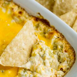 Green Chile Cheddar Dip with cream cheese, cheddar, green chiles, and spices is simple to mix together in minutes. It's then baked until hot, gooey, and bubbly. #TexMex #dip #recipe #creamcheese #greenchiles #hatch