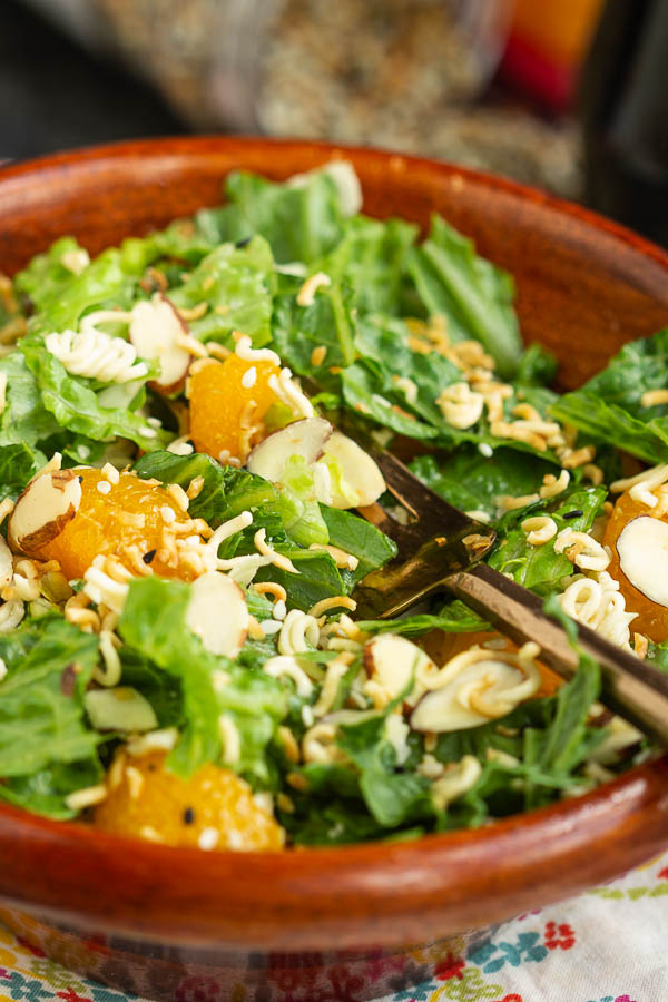 Romaine Toss, a zesty, sweet and spicy salad is a perfect lunch or side in 5 minutes! #salad #recipe #romaine #orange #mandarinorange #easy #ramen #almonds #healthy #greensalad Romaine Toss