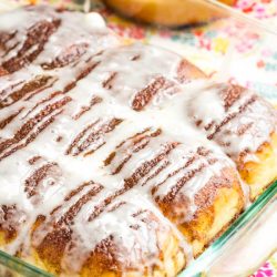 cinnamon buns in a glass baking dish.