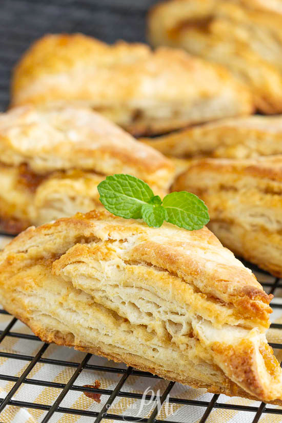 Perfectly buttery and subtly sweet, Fig Scones are a delicious way to start the day. Layers of flaky dough and fig jam offer a savory and slightly sweet combination. #scones #biscuits #bread #recipe #breakfast #brunch #pineapple #coconut #baked #baking Fig Scones