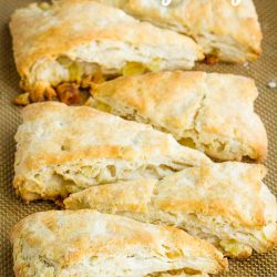 These sweet Tropical Pineapple Coconut Scones have punches of tropical flavor between buttery layers of tender, flaky dough.  #scones #biscuits #bread #recipe #breakfast #brunch #pineapple #coconut #baked #baking