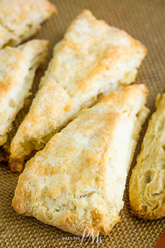 These sweet Tropical Pineapple Coconut Scones have punches of tropical flavor between buttery layers of tender, flaky dough.  #scones #biscuits #bread #recipe #breakfast #brunch #pineapple #coconut #baked #baking