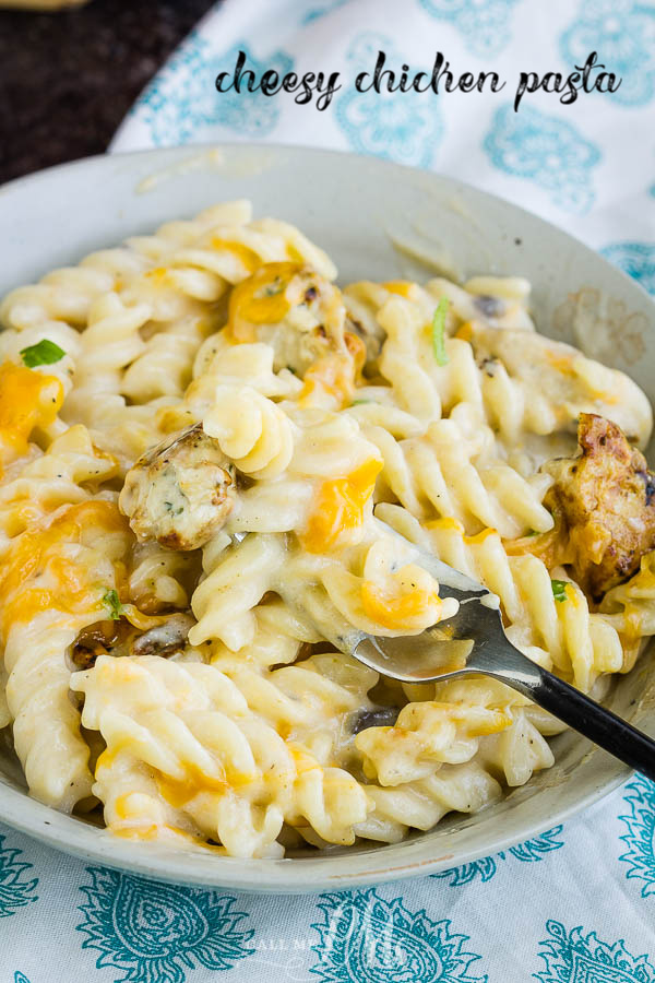 Super cheesy and creamy, Cheesy Chicken Rotini will become your new favorite, go-to weeknight recipe! #pasta #chicken #cheese #recipe #casserole Cheesy Chicken Rotini