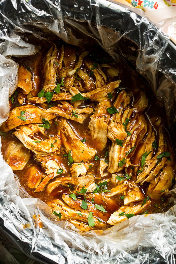 Fall-apart tender, Slow Cooker Asian Glazed Chicken is a super easy recipe that your whole family will love. #slowcooker #chicken #recipe #crockpot #Asian #sweetsour Slow Cooker Asian Glazed Chicken